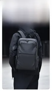 Detail of waterproof black backpack with multi-layer storage and wide shoulder straps