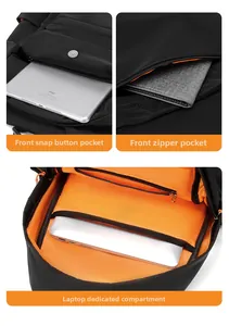 Detail view of laptop compartment with orange lining and magnetic front pocket