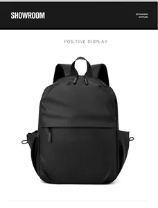 Front view of a minimalist black waterproof laptop backpack with side drawstring pockets