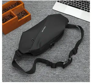 Detail view of black waist bag with Fashion male text and adjustable nylon strap buckles