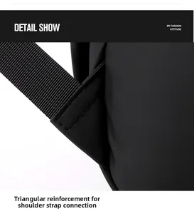 Close-up of reinforced triangle stitching on black laptop backpack shoulder strap detail
