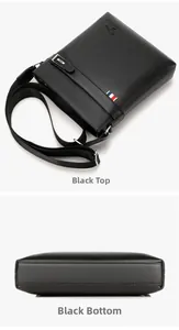 Detail view of black textured leather crossbody bag with adjustable strap and logo