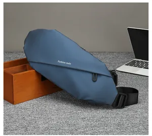 Detail of blue waterproof sling bag with Fashion Male logo on a modern desktop