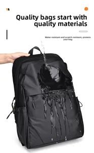 Waterproof detail of a black laptop backpack showing water resistance on fabric