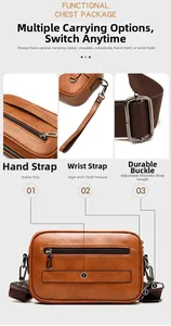 Detail view of brown textured leather crossbody bag showing adjustable strap and metallic hooks