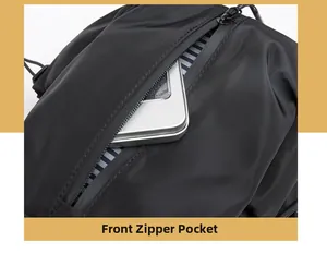 Detailed close-up showing the front zipper pocket with striped lining of the black travel bag
