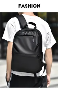 Outdoor shot of a man wearing a large capacity black business casual laptop backpack