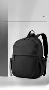 Detail of high capacity black laptop backpack with multi-compartment storage and waterproof fabric