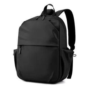 Minimalist black laptop backpack with waterproof matte finish and spacious compartments