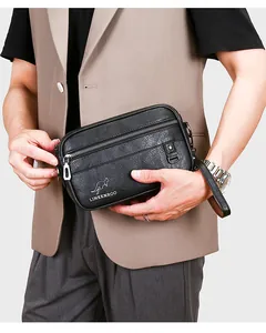 Detail of black pebbled leather texture with Linkenroo logo on men's crossbody bag