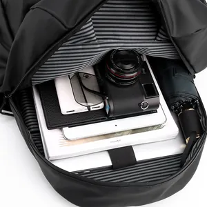 Minimalist black laptop backpack with high-capacity interior and striped lining