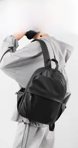 Men's black waterproof laptop backpack shown on model highlighting ergonomic fit
