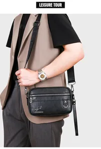 Close-up of litchi grain leather texture and brand logo on men's crossbody bag