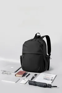 Detail view of large capacity black waterproof backpack with top handle and side pocket