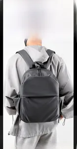Close-up of waterproof matte texture and multi-layer design on the black laptop backpack
