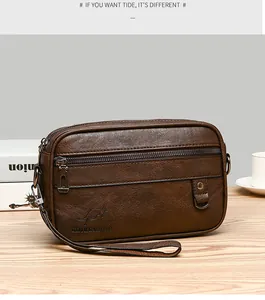 Detail of dark brown leather texture and kangaroo logo on men's business clutch bag