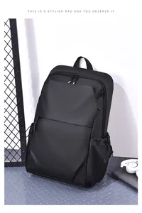Detail view of water-resistant black business backpack with hidden front zipper pocket