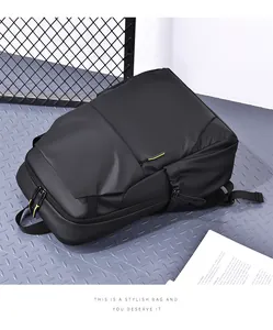 Detail of waterproof black business backpack with vibrant fluorescent yellow zipper accents