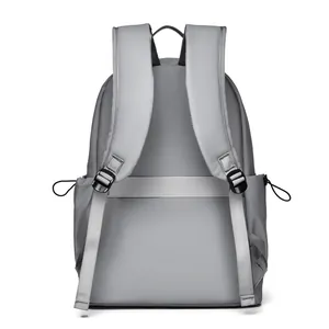 Grey ergonomic backpack with padded straps and luggage sleeve for travel and business