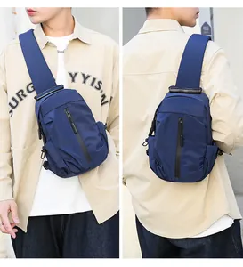 Detail view of large capacity waterproof navy blue chest bag showing front and back wear