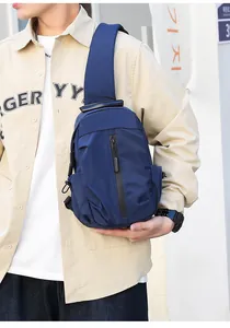 Men's navy blue water-resistant crossbody chest bag with vertical waterproof zipper detail