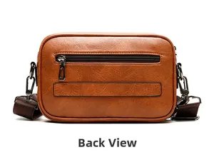 Back view of brown vintage leather crossbody bag featuring rear zipper and metal buckles