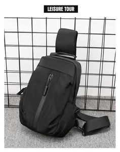 Detailed view of black nylon chest bag with vertical zipper and durable plastic buckle