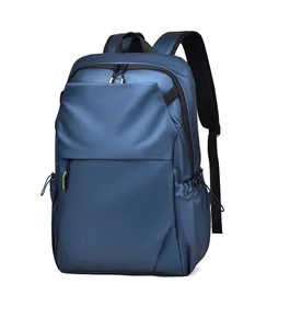 Detail of navy blue backpack showing waterproof material and side drawstring pocket