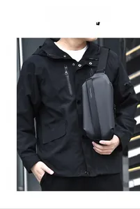 Close-up of waterproof matte texture and magnetic buckle on men's tactical chest bag