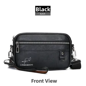 Close-up of black textured leather crossbody bag with zipper and kangaroo logo