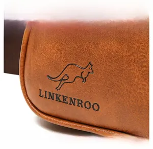 Detailed macro view of the brown PU leather texture and embossed kangaroo logo on the bag