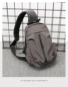 Detail of the gray tactical chest bag with breathable honeycomb mesh padding on strap