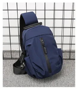 Detail view of large capacity navy blue waterproof nylon chest bag for men traveling