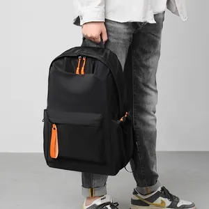 Business casual black backpack with orange accents for travel and laptop storage