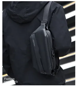 Detail of waterproof black crossbody chest bag with adjustable nylon strap on a model