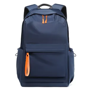 Navy blue waterproof business backpack with orange zipper details and large capacity