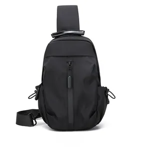 Front view of black waterproof nylon sling bag with vertical zipper and side pockets