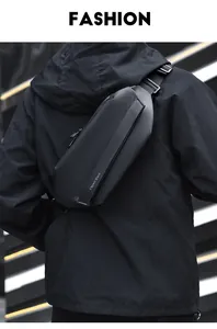 Detail of waterproof matte chest bag on a black hoodie with brand lettered strap