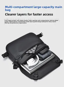 Vista dall'alto di borsa a tracolla capiente con scomparti per laptop da 14 pollici e accessori