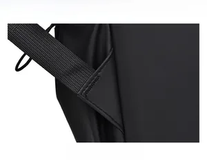 Macro shot of reinforced triangle stitching on the black waterproof nylon backpack strap
