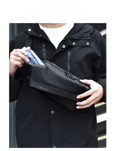 Detail showing the large capacity of a waterproof black chest bag with smooth double zippers