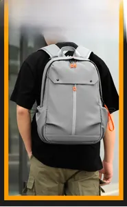 Sac à dos gris business pour homme avec détails orange et poches multiples