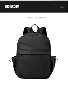 Front view showing the matte waterproof fabric and large front pocket of the black backpack