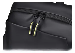 Detail of waterproof matte black fabric and dual zippers with yellow pull tabs