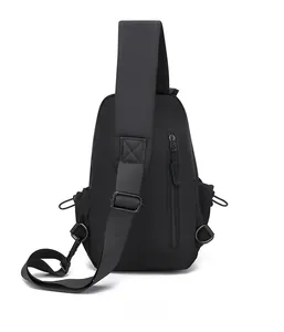 Detail view of the back of a black travel chest bag with padded straps and hidden zipper