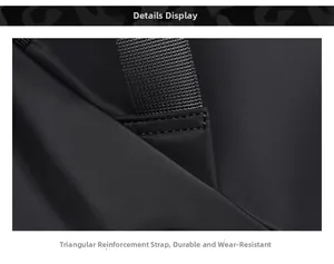 Close-up of triangle reinforced stitching on black business backpack shoulder straps