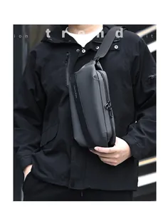 Detail of dark grey waterproof chest bag featuring a matte finish and adjustable strap