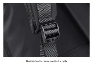 Close-up of durable black buckle and adjustable nylon strap on a business backpack