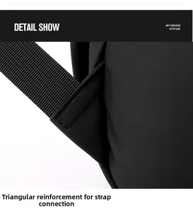 Detail view of triangular reinforcement stitching on the black backpack shoulder straps