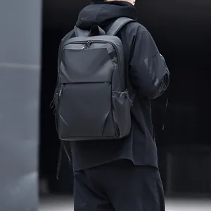 Minimalist black waterproof laptop backpack for men featuring multi-functional compartments